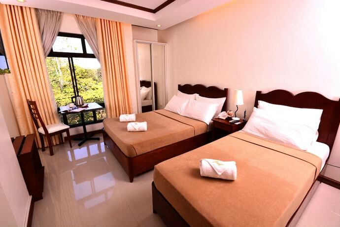 Imagen de la habitación del Hotel Ipil Suites Puerto Princesa. Foto 20