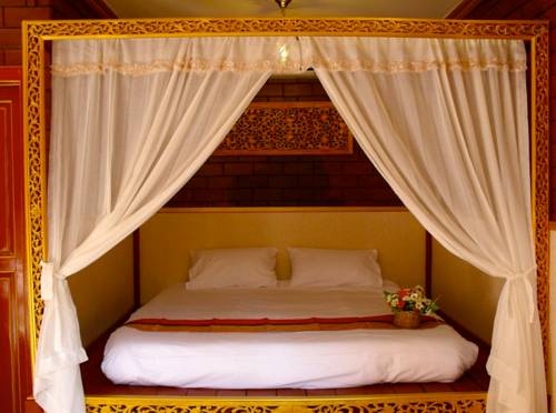 Imagen de la habitación del Hotel Irawadee Resort. Foto 10