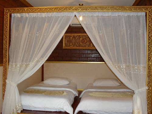 Imagen de la habitación del Hotel Irawadee Resort. Foto 15