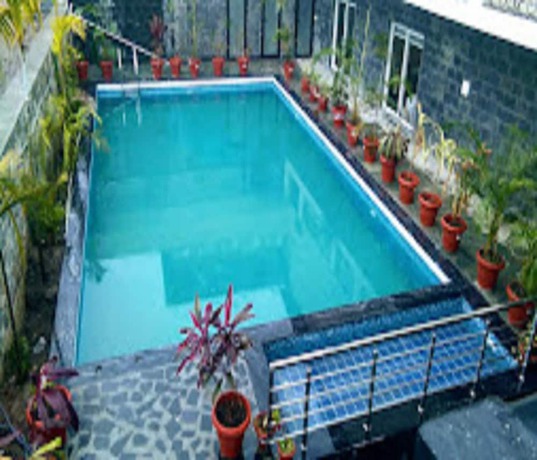 Imagen de la piscina del Hotel Iris Lite Corbett. Foto 7