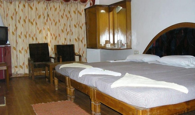 Imagen de la habitación del Hotel Iroomz Shanbhag Towers International. Foto 8