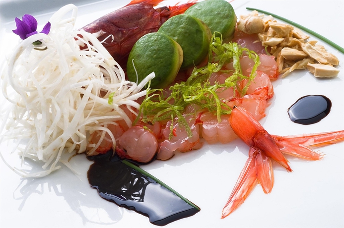 Imagen del bar/restaurante del Hotel Is Molas Resort. Foto 2