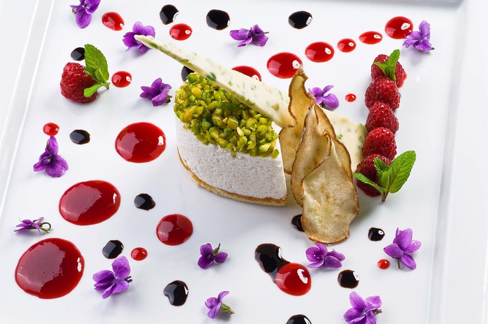 Imagen del bar/restaurante del Hotel Is Molas Resort. Foto 7