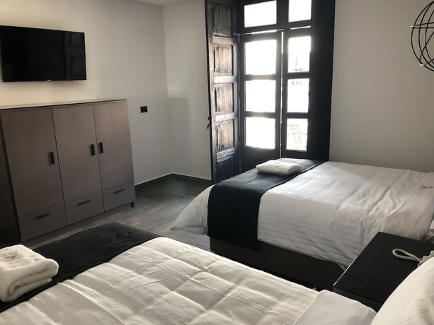 Imagen de la habitación del Hotel Isabel, Centro Hist&oacute;rico de Puebla. Foto 11