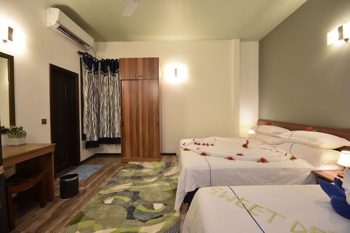 Imagen de la habitación del Hotel Island Home Ukulhas. Foto 17