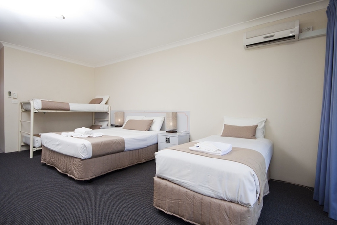 Imagen de la habitación del Hotel Island Palms Motor Inn. Foto 2