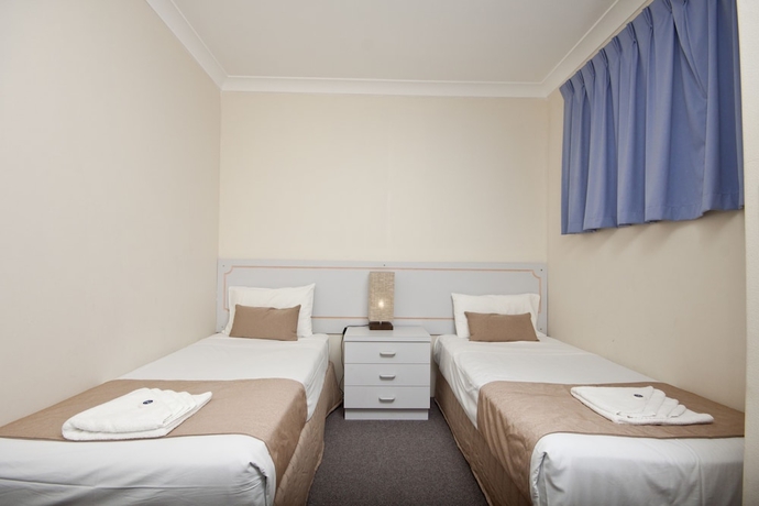 Imagen de la habitación del Hotel Island Palms Motor Inn. Foto 13