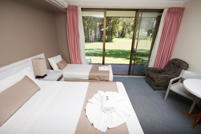 Imagen de la habitación del Hotel Island Palms Motor Inn. Foto 16