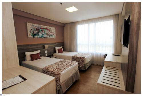 Imagen de la habitación del Hotel It Itabira. Foto 8