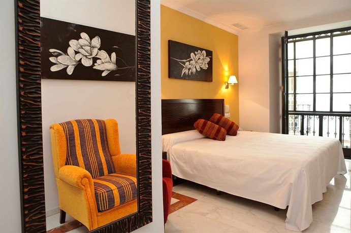 Imagen de la habitación del Hotel Itaca Sevilla By Soho Boutique. Foto 7