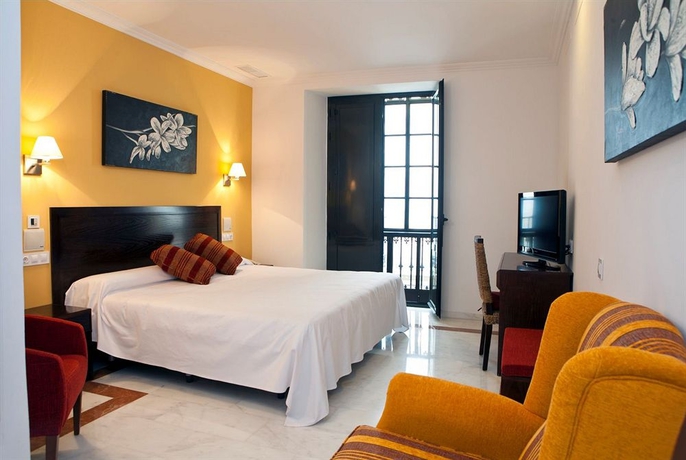 Imagen de la habitación del Hotel Itaca Sevilla By Soho Boutique. Foto 8