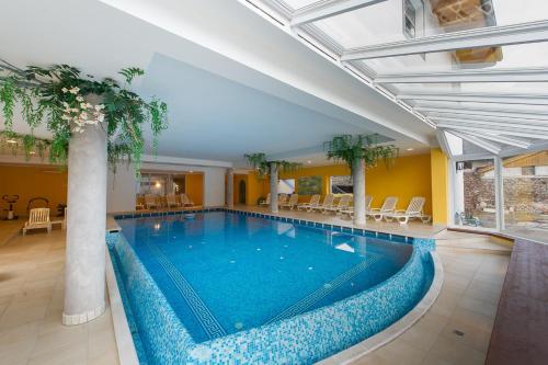 Imagen de la piscina del Hotel Italia, Castello di Fiemme. Foto 4