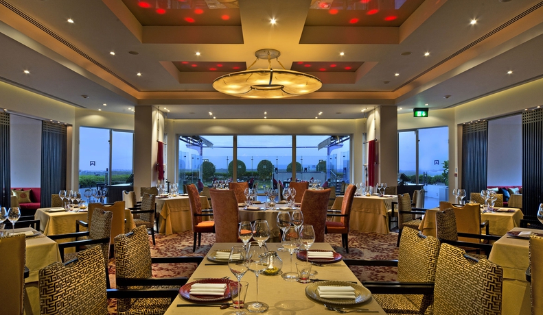 Imagen del bar/restaurante del Hotel Itc Maurya, A Luxury Collection , New Delhi. Foto 5