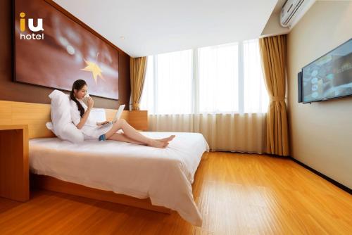Imagen de la habitación del Hotel Iu Wuhan Guanggu Minzu Avenue Wuchang Instit. Foto 6