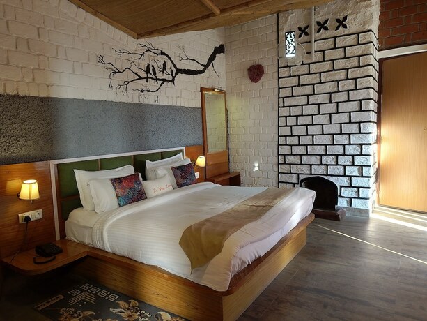 Imagen de la habitación del Hotel Ivy Green Resort. Foto 14