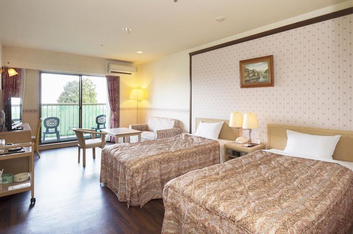 Imagen de la habitación del Hotel Izukogen Wanwan Paradise Condominium. Foto 3