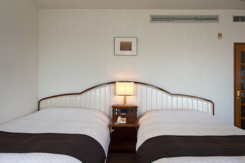 Imagen de la habitación del Hotel Izukogen Wanwan Paradise and Cottage. Foto 10