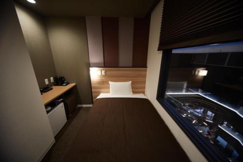 Imagen de la habitación del Hotel Izumisano Center. Foto 7