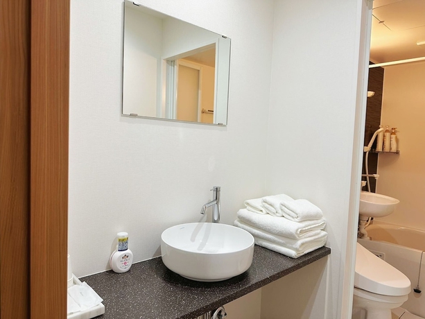Imagen de la habitación del Hotel Izumisano Home. Foto 18