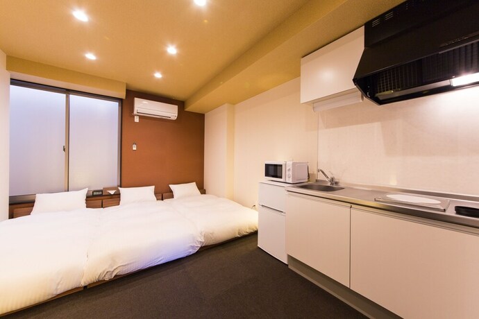 Imagen de la habitación del Hotel JAPANING KUJO. Foto 11