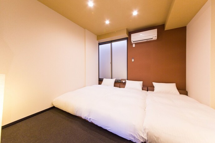 Imagen de la habitación del Hotel JAPANING KUJO. Foto 13