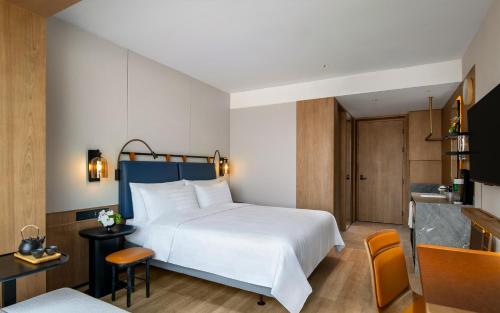 Imagen de la habitación del Hotel JEN Kunming by Shangri-La. Foto 16