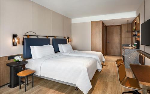 Imagen de la habitación del Hotel JEN Kunming by Shangri-La. Foto 17