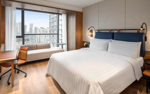 Imagen de la habitación del Hotel JEN Kunming by Shangri-La. Foto 18