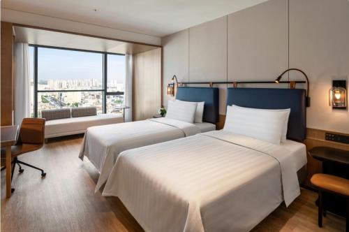 Imagen de la habitación del Hotel JEN Kunming by Shangri-La. Foto 19