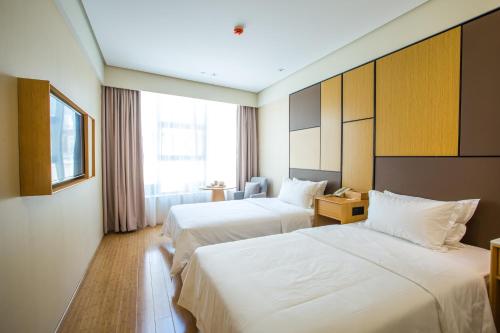 Imagen de la habitación del Hotel JI Hotel Shanghai Changshou Road. Foto 2