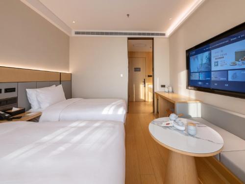Imagen de la habitación del Hotel JI Shanghai Pudong Airport East Station-全季上海浦东机场东站酒店-酒店提供浦东机场免费穿梭巴士. Foto 18