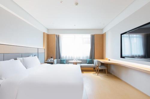 Imagen de la habitación del Hotel JI Wuhan Baishazhou Hongshan Vanke Plaza Branch. Foto 15