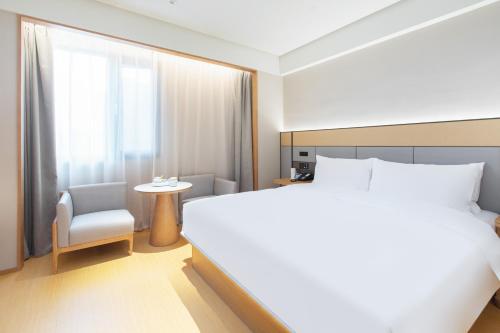 Imagen de la habitación del Hotel JI Wuhan Baishazhou Hongshan Vanke Plaza Branch. Foto 16