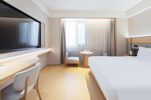 Imagen de la habitación del Hotel JI Wuhan Baishazhou Hongshan Vanke Plaza Branch. Foto 17