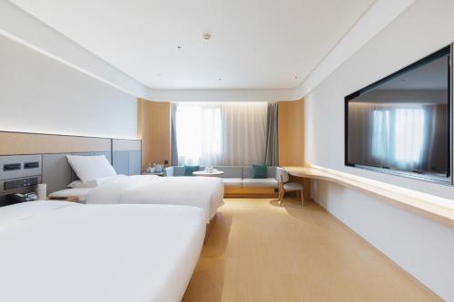 Imagen de la habitación del Hotel JI Wuhan Baishazhou Hongshan Vanke Plaza Branch. Foto 18
