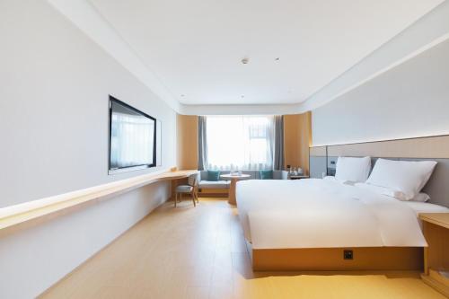 Imagen de la habitación del Hotel JI Wuhan Baishazhou Hongshan Vanke Plaza Branch. Foto 19