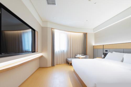 Imagen de la habitación del Hotel JI Wuhan Baishazhou Hongshan Vanke Plaza Branch. Foto 20
