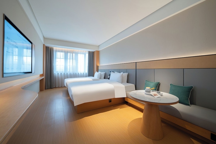 Imagen de la habitación del Hotel JI Zhangzhou Yuehui Plaza. Foto 12