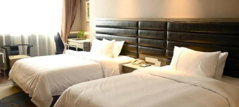 Imagen de la habitación del Hotel JINDI MINGTING HOTEL. Foto 8