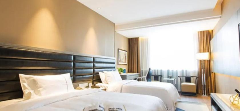 Imagen de la habitación del Hotel JINDI MINGTING HOTEL. Foto 12