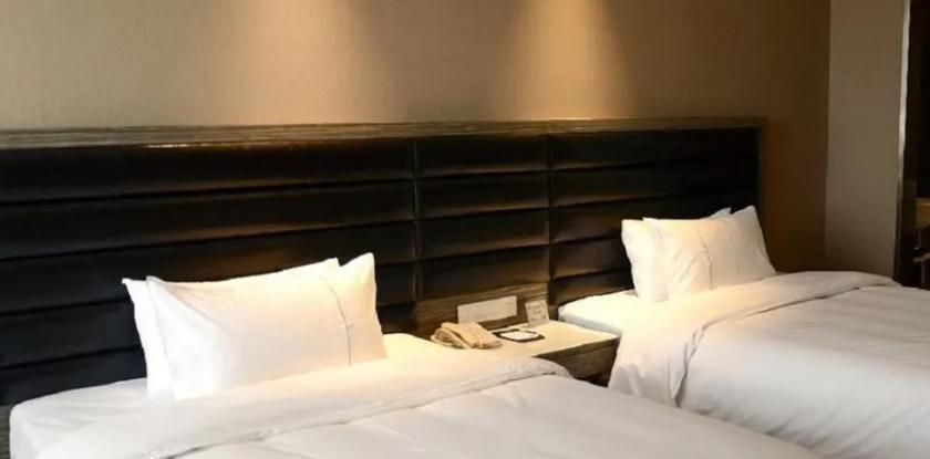 Imagen de la habitación del Hotel JINDI MINGTING HOTEL. Foto 13