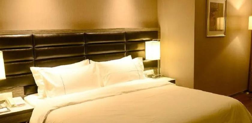 Imagen de la habitación del Hotel JINDI MINGTING HOTEL. Foto 15