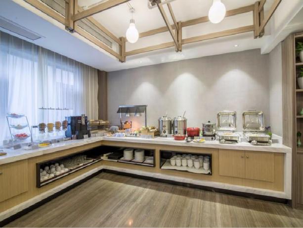 Imagen del bar/restaurante del Hotel JINJIANG METROPOLO HOTEL HANGZHOU HUANGLONG WENSAN. Foto 5