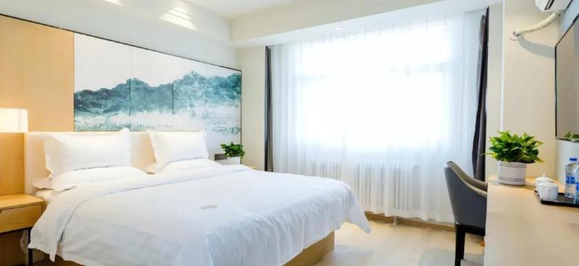 Imagen de la habitación del Hotel JINYI YOUXUAN HOTEL (XINHUAXI ST. FUYUAN. Foto 2