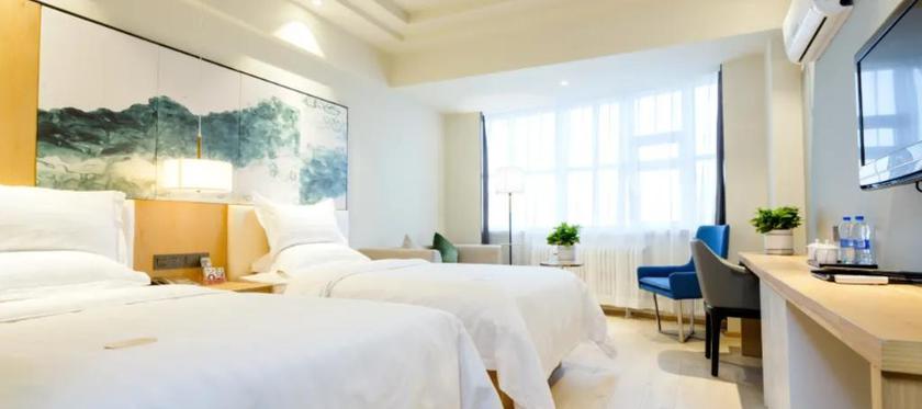 Imagen de la habitación del Hotel JINYI YOUXUAN HOTEL (XINHUAXI ST. FUYUAN. Foto 6