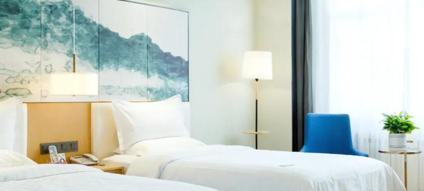 Imagen de la habitación del Hotel JINYI YOUXUAN HOTEL (XINHUAXI ST. FUYUAN. Foto 8