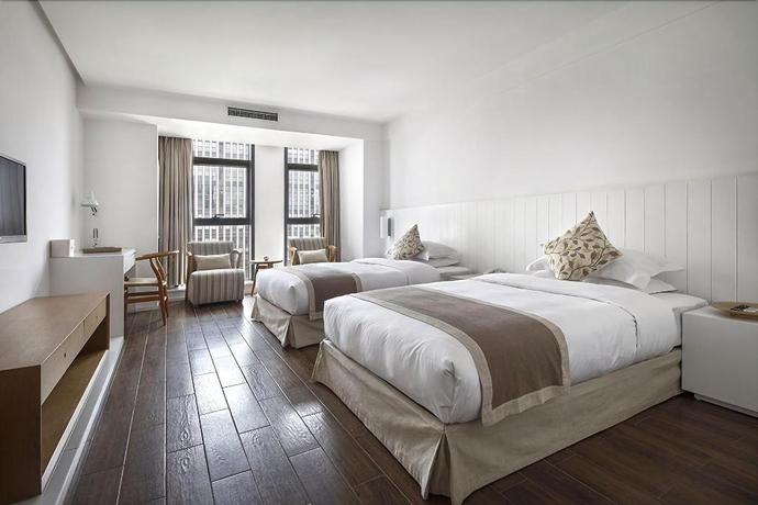 Imagen de la habitación del Hotel JINYUE HENGMEI BOUTIQUE HOTEL. Foto 7