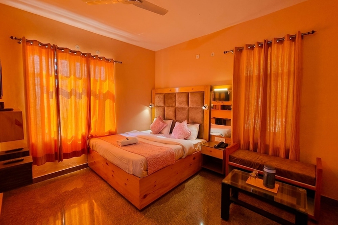 Imagen de la habitación del Hotel JK Dharamshala. Foto 1