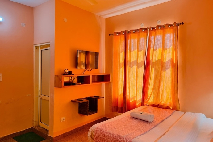 Imagen de la habitación del Hotel JK Dharamshala. Foto 2