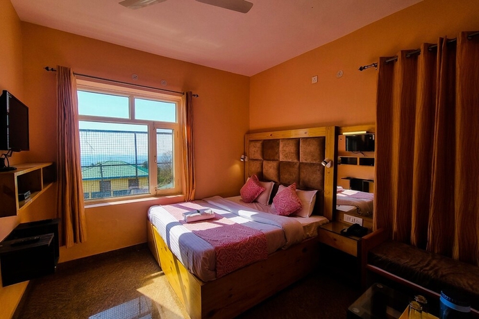 Imagen de la habitación del Hotel JK Dharamshala. Foto 17